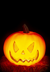 Halloween Background with a Lit Jack-o-Lantern