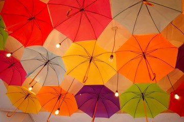 ceiling of a large number of colorful floating parasols