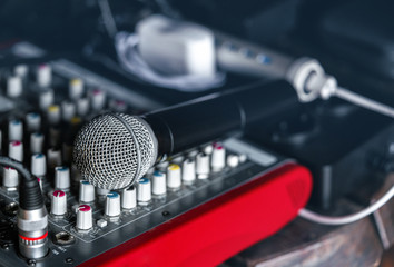 Mixing console and a wireless microphone closeup.