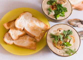 Food. Cream soup with сhampignon, greens, toasts