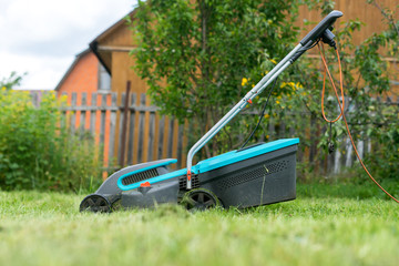 Fototapeta premium outdoor worker mowing the lawn