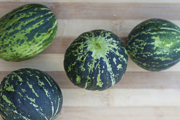 Organic tomatoes, fresh cucumber and unripe watermelon