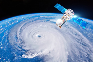 Research, probing, monitoring hurricane Florence. Satellite above the Earth makes measurements of...