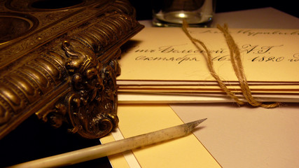 Vintage paper and envelopes with quill and bronze mask
