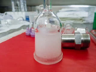 Glass accessory to adapt different flasks to a rotary evaporator. Laboratory glassware.