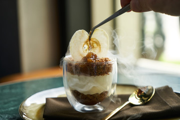 New york cheese cake dessert with mousse with apple cream, caramel, muskovado, close-up. Healthy breakfast food