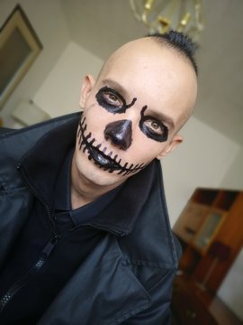 Halloween portrait of young man. Psycho. Horror clown.