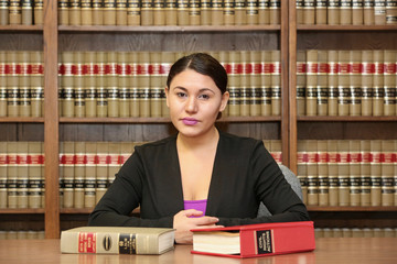 Young attractive female activist. Young woman lawyer in law office