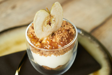 Dessert New york cheese cake with mousse with apple cream, caramel, muskovado, close-up. Healthy breakfast food