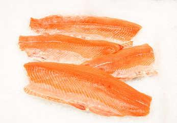 Fresh salmon on ice at the supermarket counter