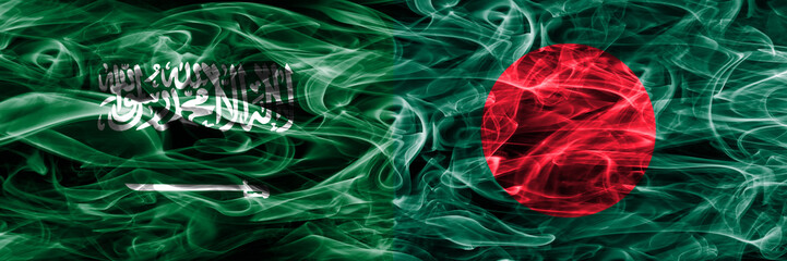Saudi Arabia vs Bangladesh smoke flags placed side by side. Thick colored silky smoke flags of Saudi Arabia and Bangladesh.