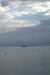 horizon,fishing boat,sea,water,seascape,sky,cloud,calm