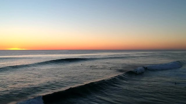 Drone footage of a spectacular sunset and surfing in Yallingup Western Australia. Watch surfers play on the waves as the sun sets into the Indian Ocean.