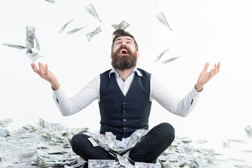 Businessman is happy with his money. Banknotes, cash dollars fly in air. Business success, richness&wealth concept. Very wealthy businessman. Happy businessman winner throws money banknotes. Dollars.