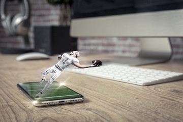Football Player with a white uniform playing and coming out of a full screen phone on a wooden...