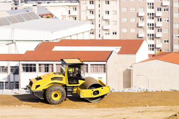 bulldozer roller working in construction site