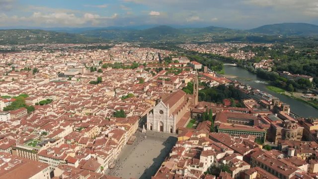 Florence aerial cityscape view on the old town with Santa Croce church and Santa Croce Plazza in Italy. 4K drone vide.
