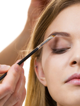Woman getting eyebrows make up done