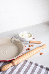 Homemade cooking ingredients and utensils on kitchen table