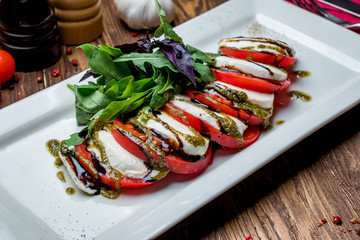 Caprese salad with mozzarella and tomato