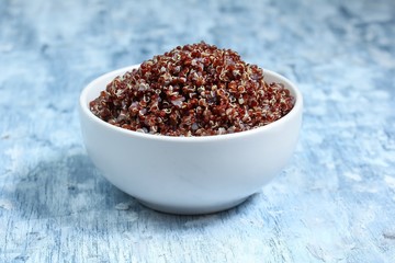 Red quinoa cooked served in a bowl, selective focus