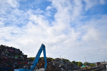 Old damaged cars piled on a scrapyard waiting for recycling. Truro, Cornwall, UK