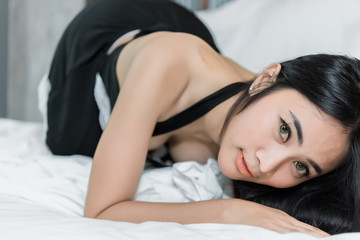Obraz na płótnie Canvas Portrait Asian sexy woman in the bed,Perfect portrait Thailand lady indoors