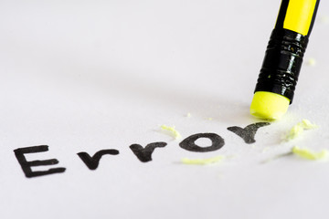 Erase the word Error with a rubber concept of eliminating the error, mistake. closeup of a pencil...