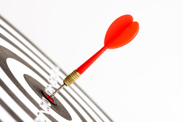 Close up shot green and red darts arrows in the target center. Business target or goal success and...