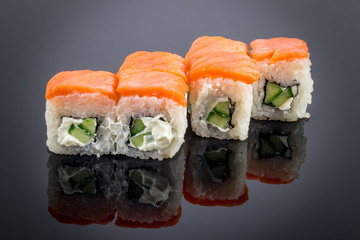 Philadelphia roll on black with reflection