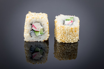 Alaska roll on black with reflection