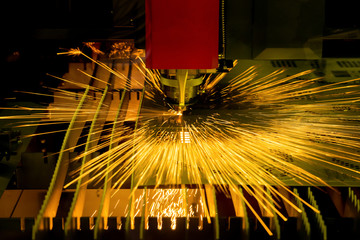 High precision CNC laser cutting metal sheet in factory.