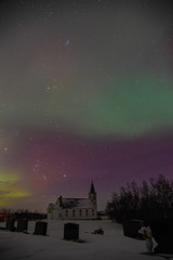 Church and cemetery under the winter night