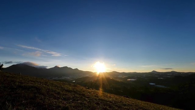 Sunrise dawn sky on the mountain in nature. Royalty high-quality free timelapse or time lapse stock video footage of sunrise or sunset on the mountain. Silhouettes view beautiful sunrise on a highland