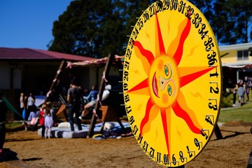 Naklejka premium Large sun tombola wheel at school fete
