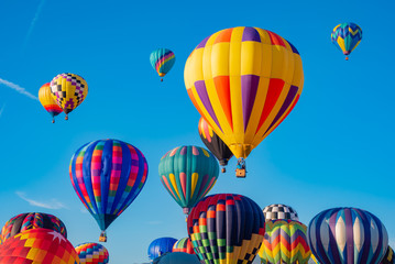 Blue sky filled with hot air balloons