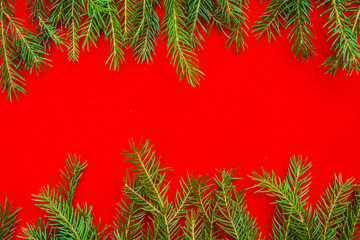 bright christmas background frame with a copy space with  fir branches  red texture