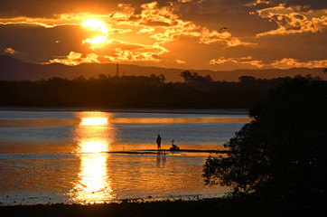 Sunset Fishing on River Bank.
