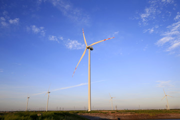 Windmill in the blue sky background