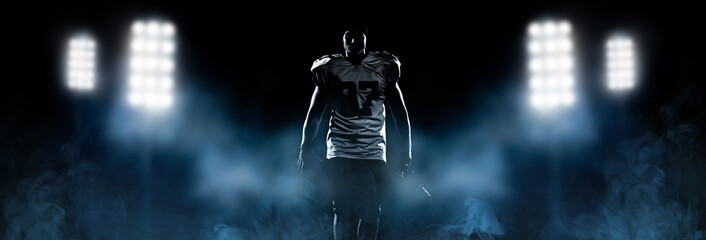 portrait of young confident American football player - Powered by Adobe