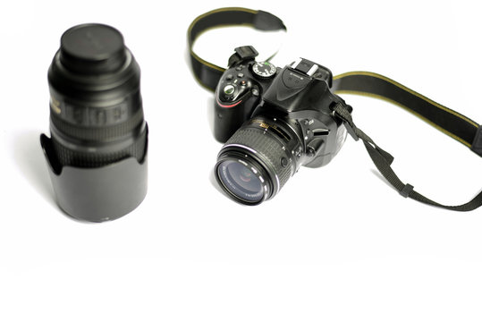 Digital SLR Camera and lens isolated on white background