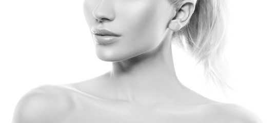 Lips and shoulders of beauty model girl. Clean skin. Black and white