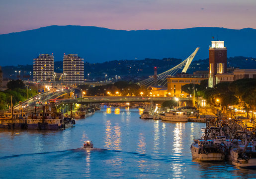 Pescara (Italy) - The view in the dusk from Ponte del Mare monumental bridge in the canal and port of Pescara city, Abruzzo region.