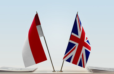 Two flags of Monaco and United Kingdom