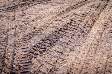 motorcycle tire track print on sand or mud with selective focus