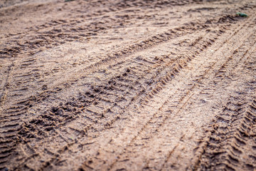 motorcycle tire track print on sand or mud with selective focus