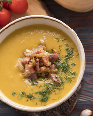 Tasty pumpkin soup with fried bacon. Top view