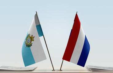 Two flags of San Marino and Netherlands