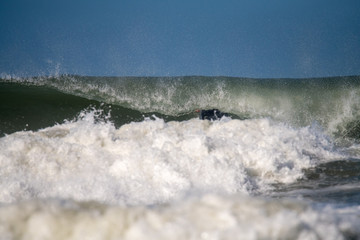Obraz premium Under cover in a tube surfing south coast of South Africa