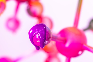 close up color of atom in heart shape are dripping. construction of molecular in heart shape...